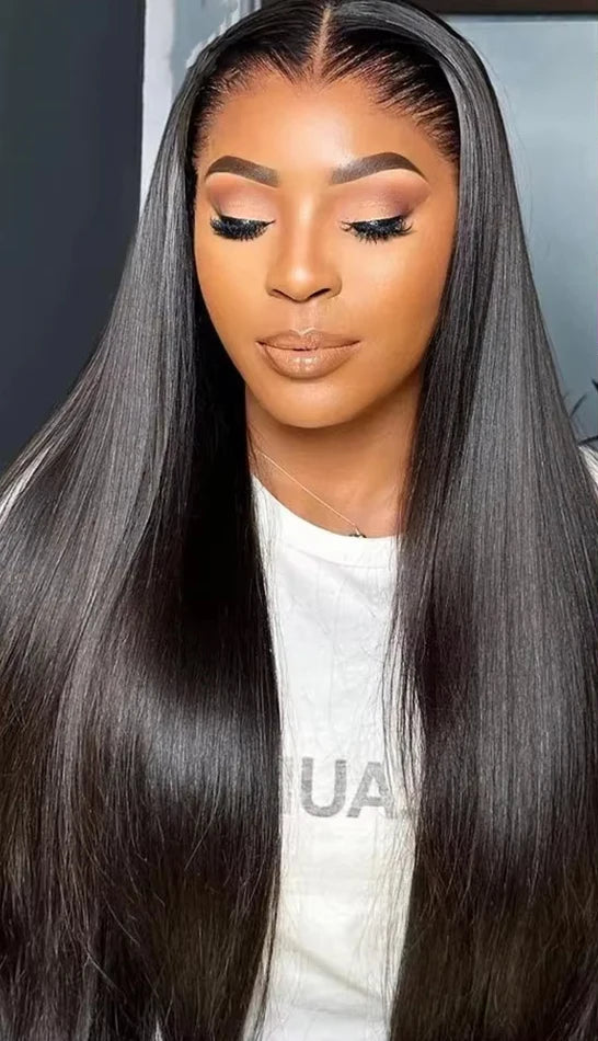 Woman with long black hair and close-up details of hairline and parting.