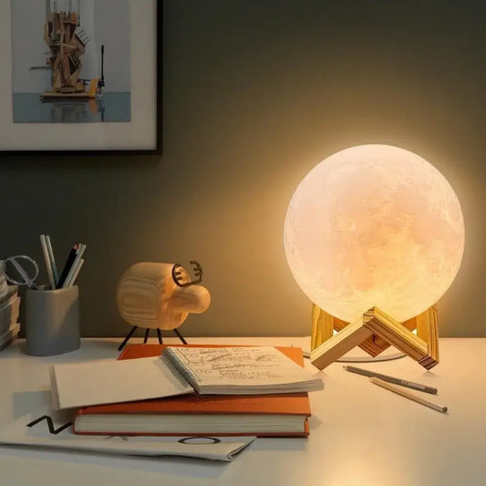 D'AuraHaven Moon Lamp glowing warm amber on wooden stand with remote control
