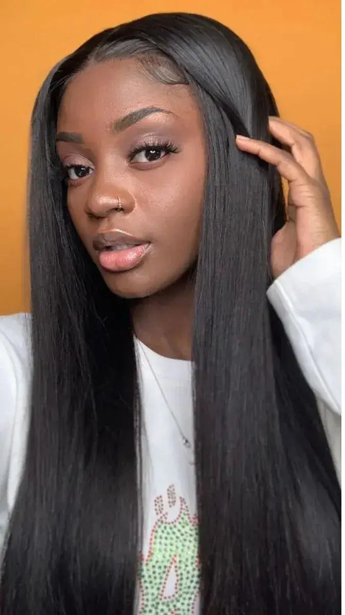 Person with long black hair and a wig